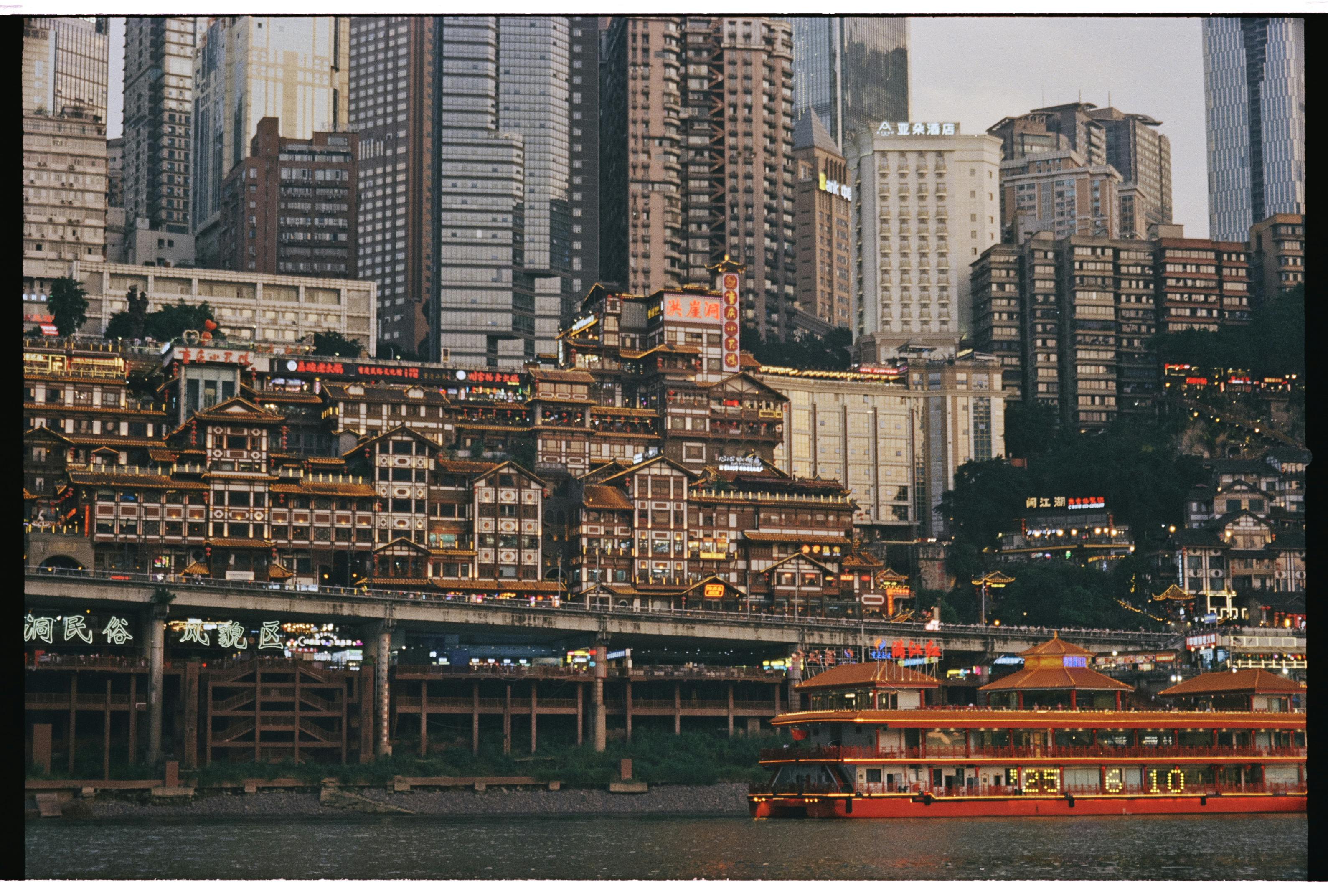Illuminated skyscrapers along a waterfront business district