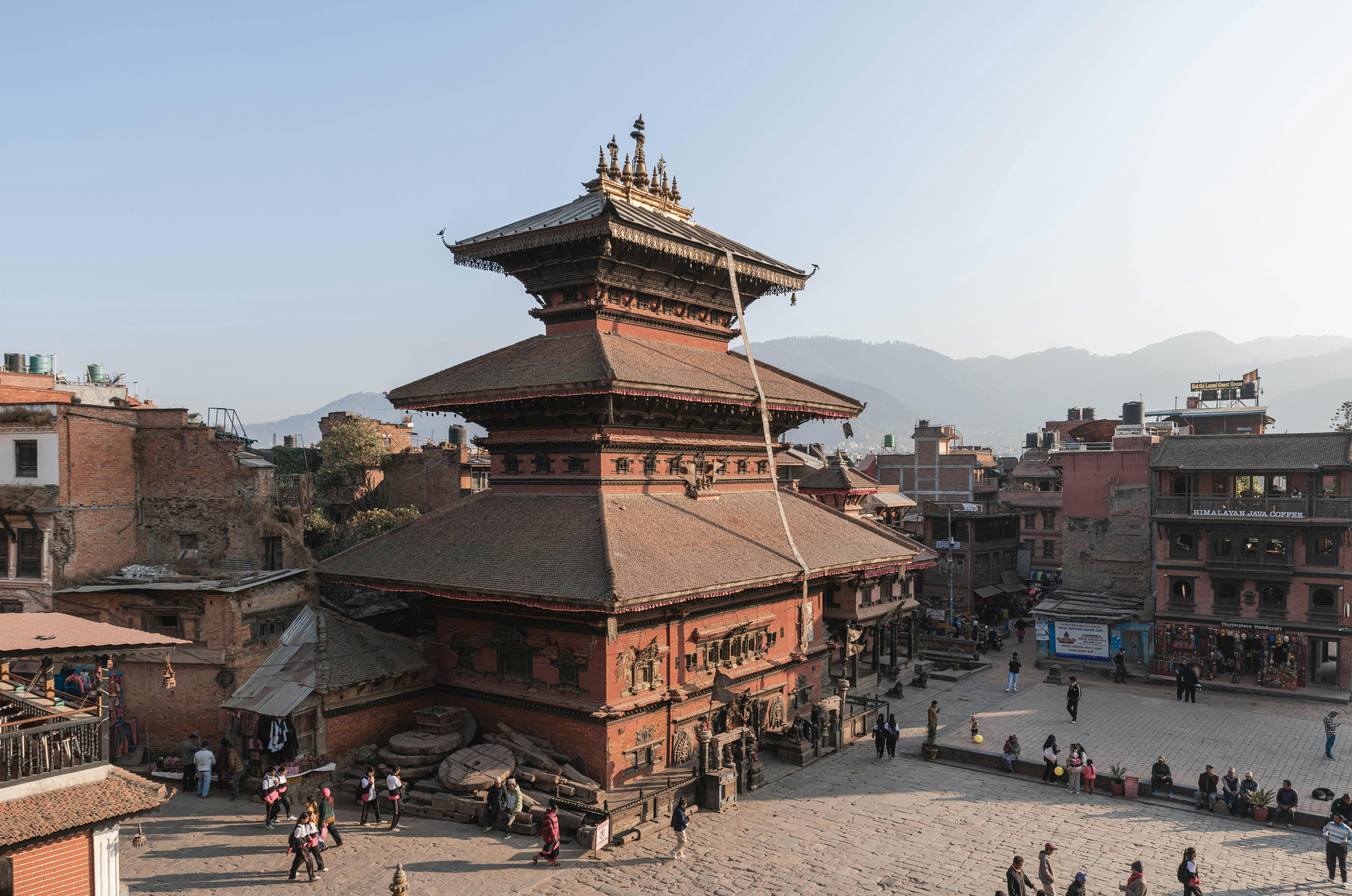 Himalayan monastery perched on a steep forested ridge